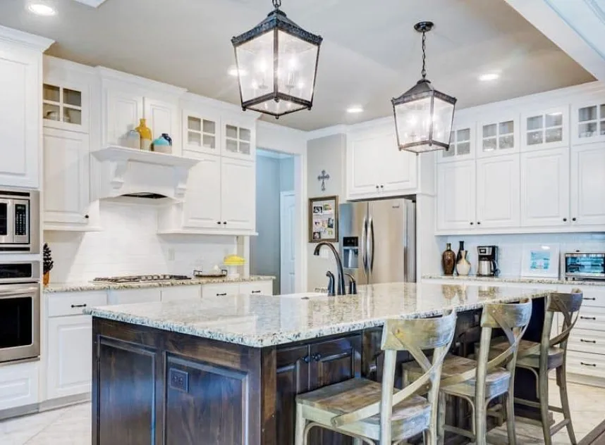 Two lantern pendant lights over a kitchen island