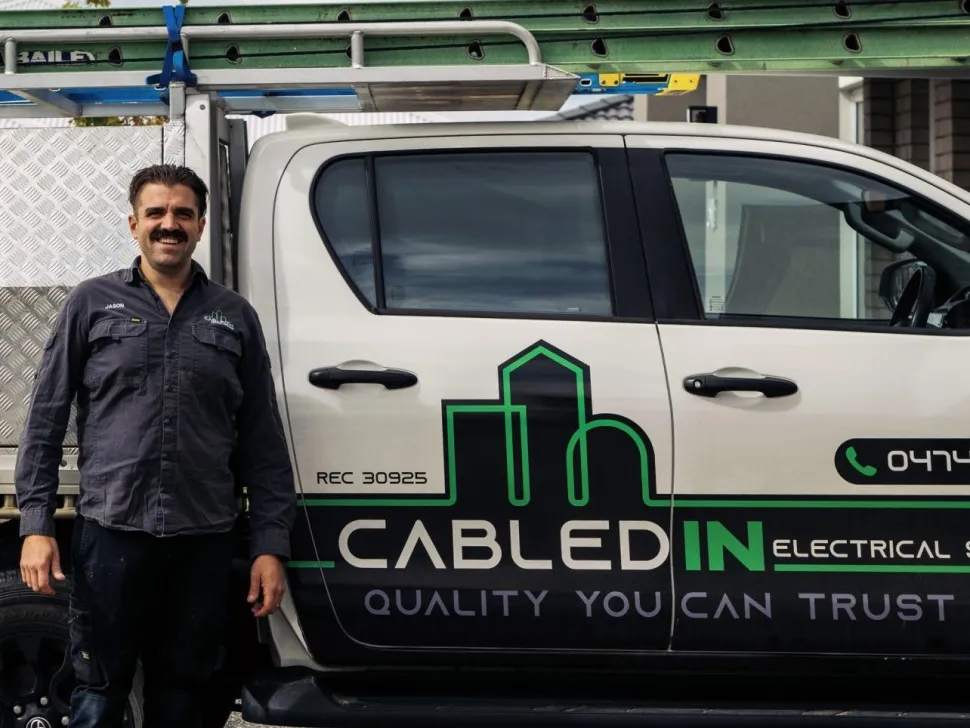 Electrician standing beside a CabledIN ute