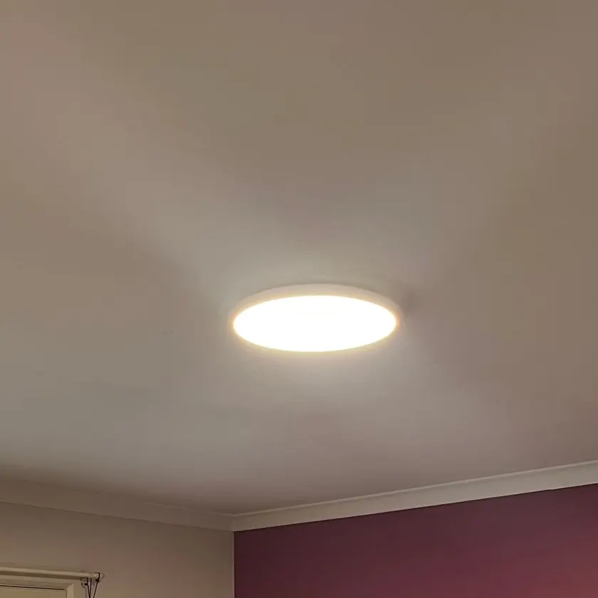 Flat LED panel on a bedroom ceiling